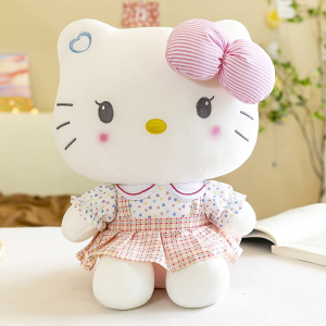 Schattige Hello Kitty pluche zittend voor een boek